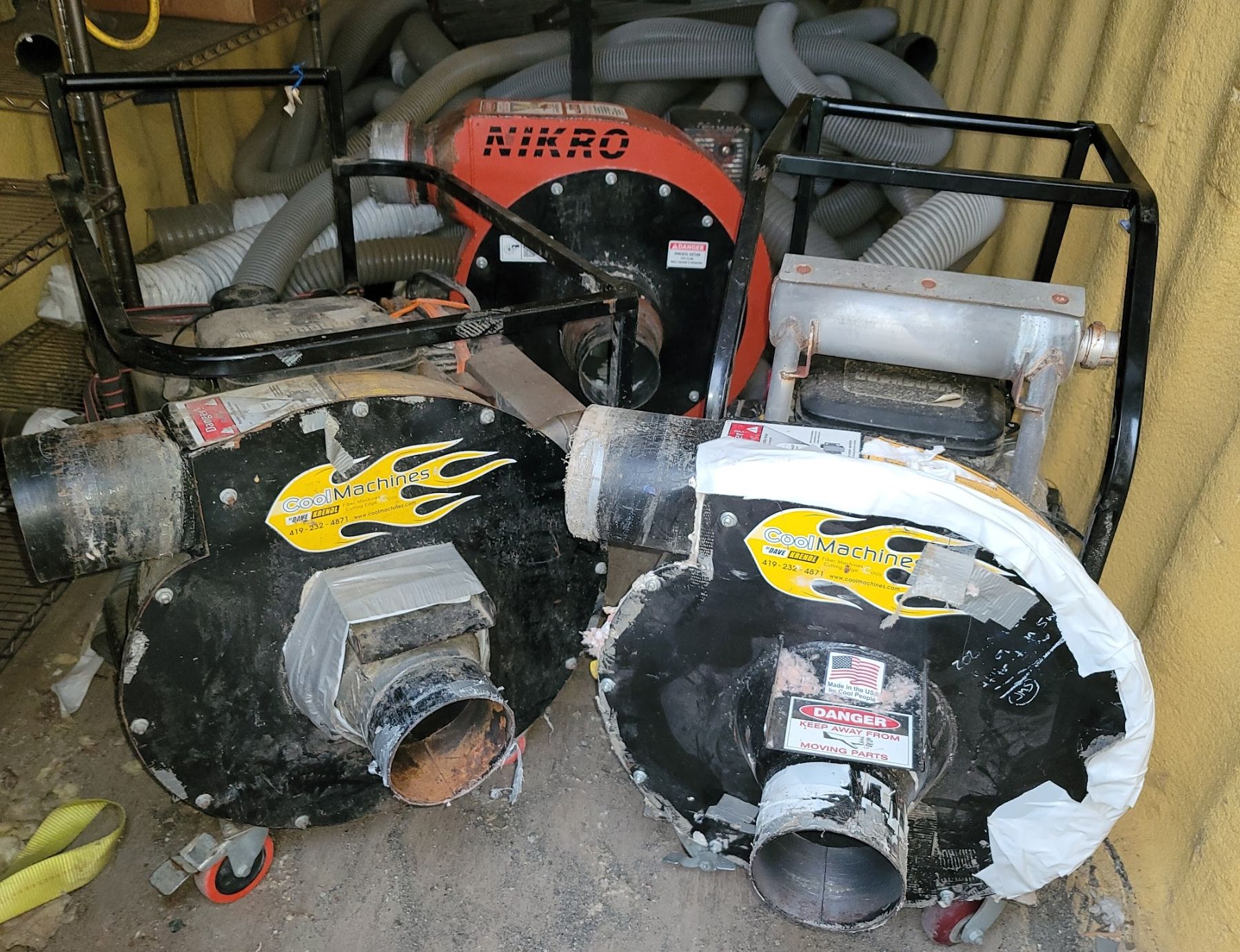 3 vacuums next to eachother