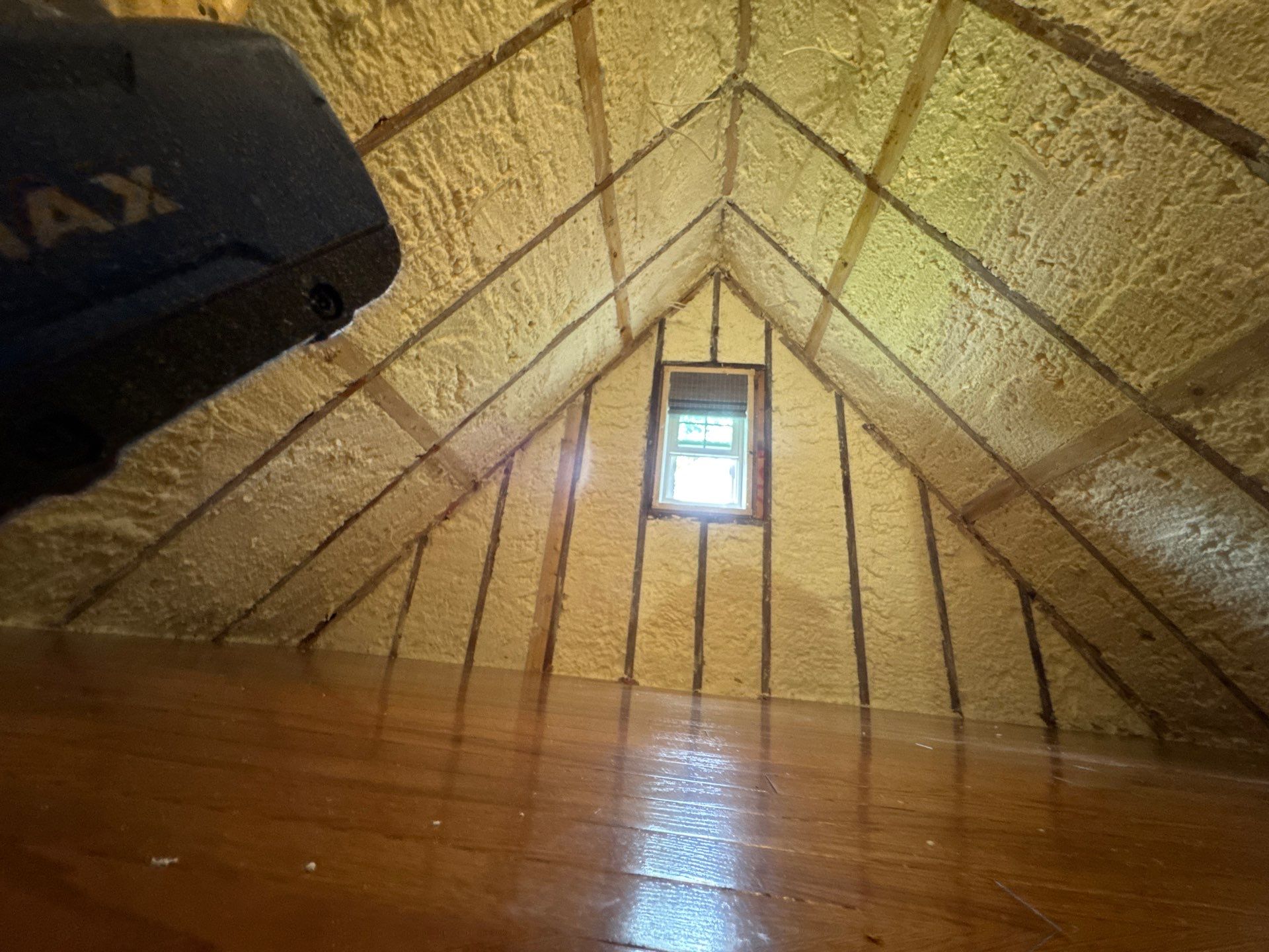upstairs room with spray foam on ceiling and walls